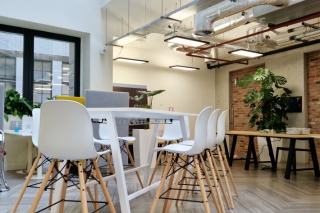 BCS London multipurpose meeting space with large table and collaboration technology