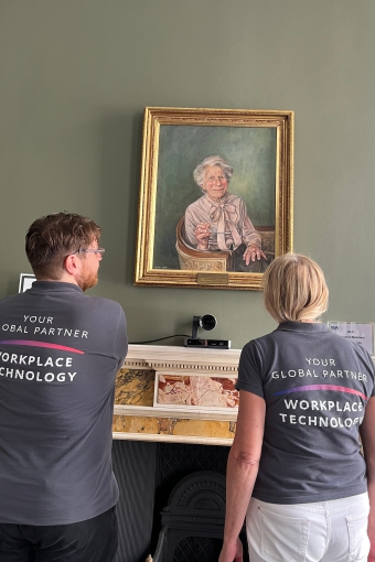 Sussi and Julian admiring a portrait at the BVA offices in London.