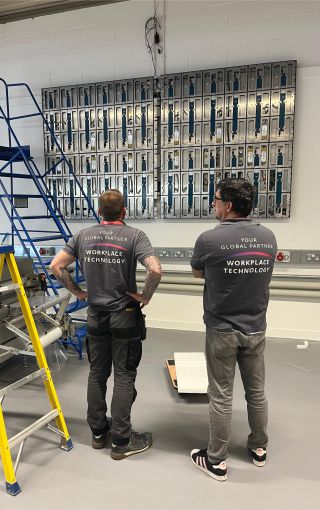 Team setting up a large al-in-one LG LED screen.