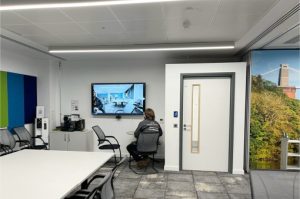 AV technician commissioning AV equipment at Bristol Airport