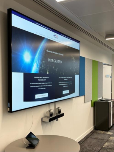 Meeting room at Bristol Airport. Al large display screen is installed with video conferencing equipment