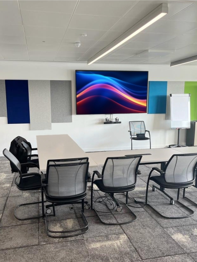 Training room at Bristol Airport. Video conferencing equipment is installed including ceiling microphones and speakers