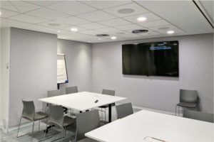 Large meeting room at BCs London offices. Video conferencing technology, ceiling microphones and speakers.