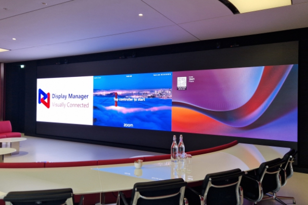 Presention suite 9m screen with Zoom and Teams Presentation suite with 9metre LED screen and curved table.