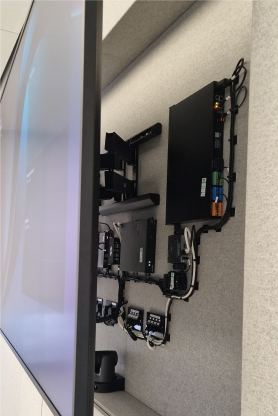 screen pulled out on bracket in meeting room Pulling of the integrated screen to see the technology behind it