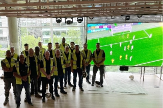 Pladis - The Heart space Display Manager installation team in 'The Heart', Townhall space at Pladis HQ.